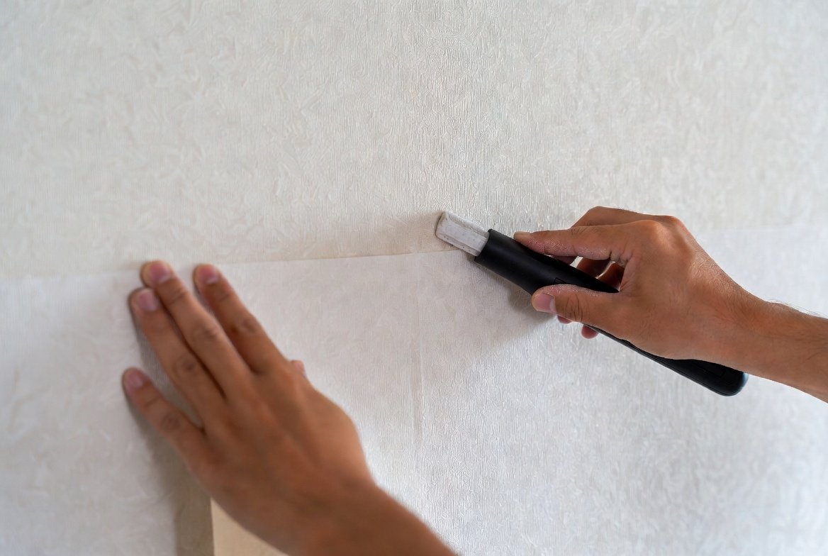 Wallpaper being hung and matched at the seam