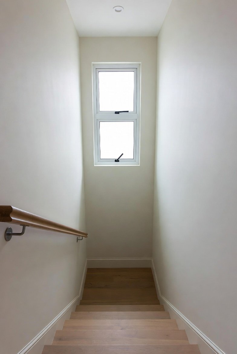Repainted stairwell and landing in a landed home